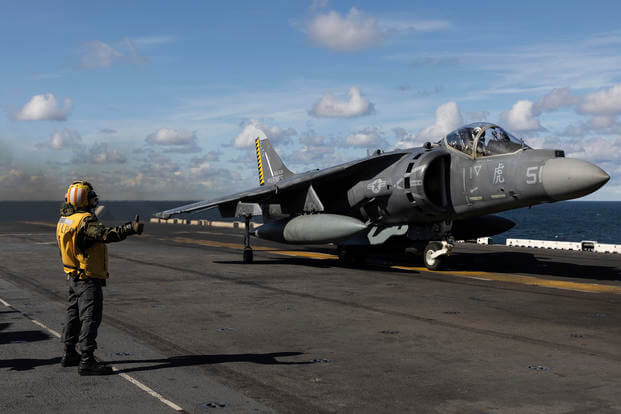 An AV-8B Harrier takes off from the flight deck of the USS Kearsarge.