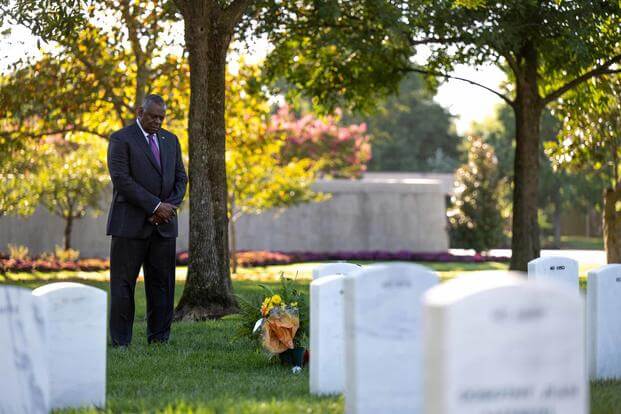 Defense Secretary Lloyd Austin pays respects at Arlington National Cemetery.