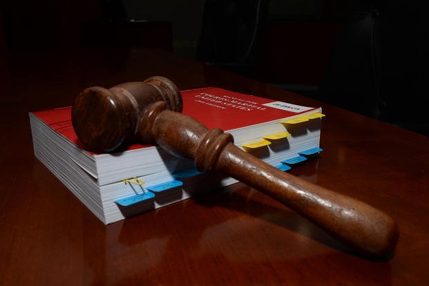 A gavel lays on the Uniform Code of Military Justice inside the 28th Bomb Wing courtroom at Ellsworth Air Force Base, S.D., July 17, 2018. (Airman 1st Class Nicolas Z. Erwin/U.S. Air Force photo)