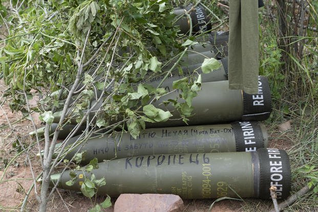 U.S.-supplied M777 howitzer shells lie on the ground in Ukraine.
