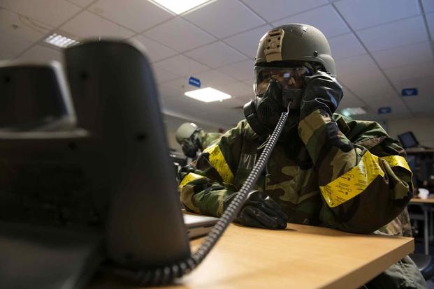 Airmen train for emergency operations in England.