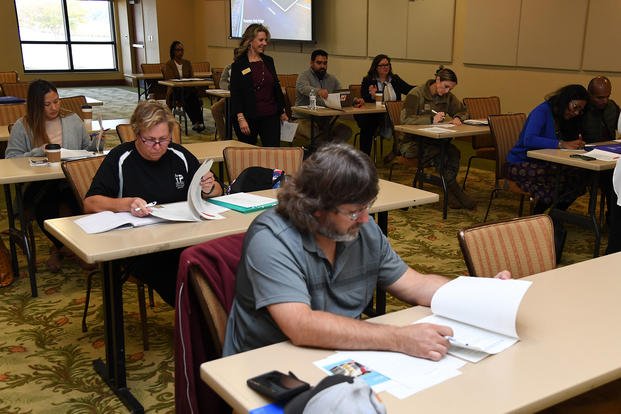 Keesler and community personnel attend a resume writing class during the Keesler Job Fair inside the Bay Breeze Event Center at Keesler Air Force Base, Mississippi.