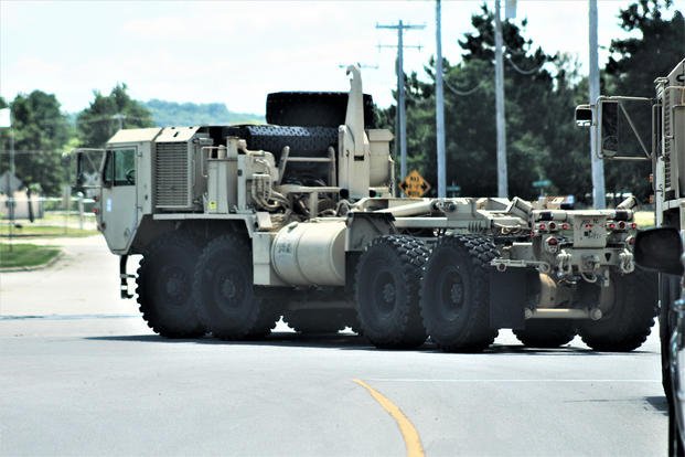 Soldiers operate an M1120 Heavy Expanded Mobility Tactical Truck (Load-Handling System) on the cantonment area during installation training operations at Fort McCoy.
