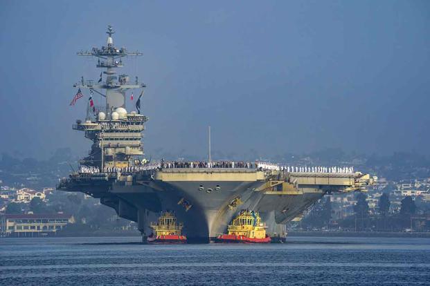 The USS Abraham Lincoln strike group sails into San Diego bay.