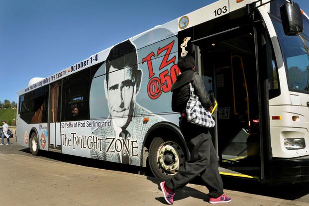 A person gets on a bus in Binghamton, New York.