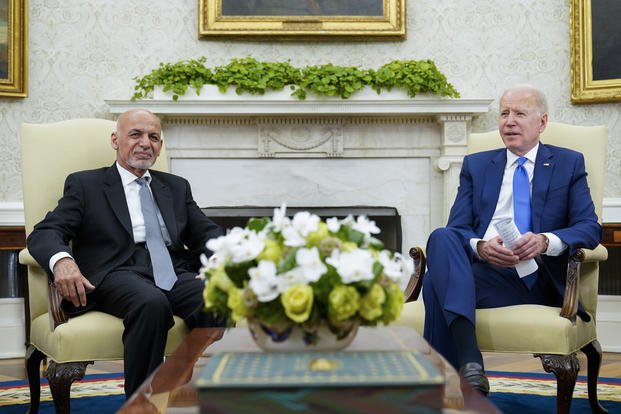 President Joe Biden, right, meets with Afghan President Ashraf Ghani