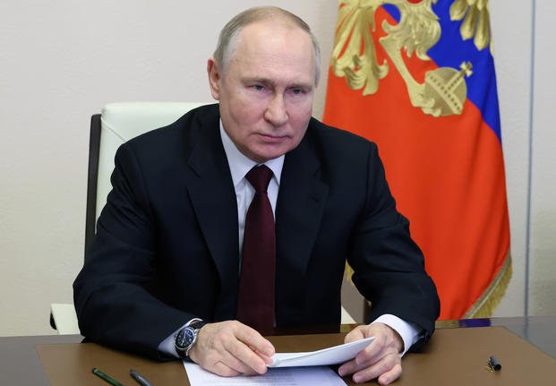 Russian President Vladimir Putin oversees the commissioning of new ships for the Russian navy
