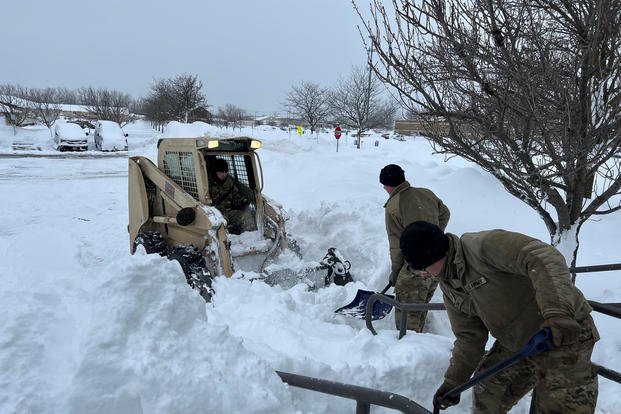 New York Army National Guard soldiers assigned to the 827th Engineer Battalion clear snow at the Cheekowaga Senior Citizens Center in Cheektowaga, New York on Dec. 26, 2022, as part of the New York state government’s response to a major snowstorm.