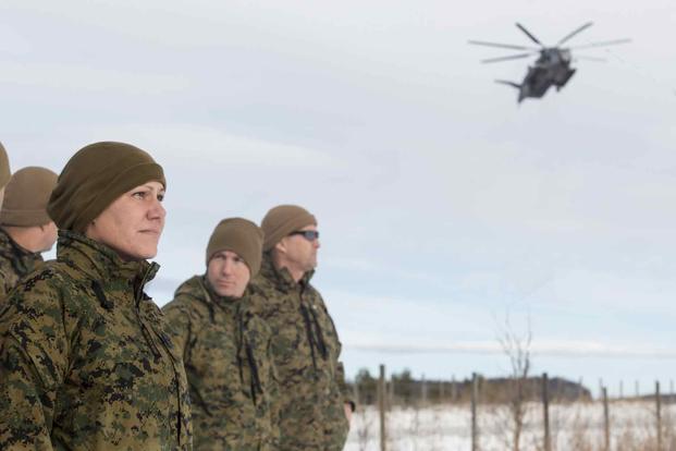 U.S. Marine Corps Sgt. Maj. Joy M. Kitashima, then sergeant major of II Marine Expeditionary Force Information Group, observes a CH-53E Super Stallion helicopter landing during Exercise Trident Juncture 18 in Dalsbygda, Norway, Nov. 1, 2018. (U.S. Marine Corps photo by Cpl. David Delgadillo) U.S. Marine Corps Sgt. Maj. Joy M. Kitashima.