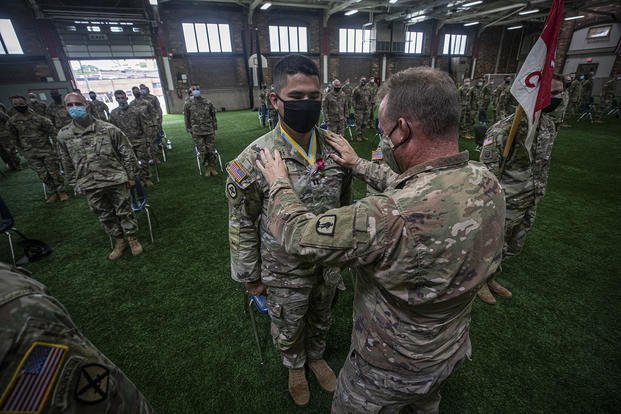 U.S. Army Capt. London Nagai is awarded the Bronze Star Medal by Lt. Col. Richard Karcher during a ceremony at the armory in Westfield, N.J.