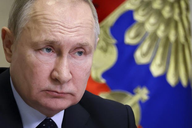 Russian President Vladimir Putin chairs a cabinet meeting via videoconference