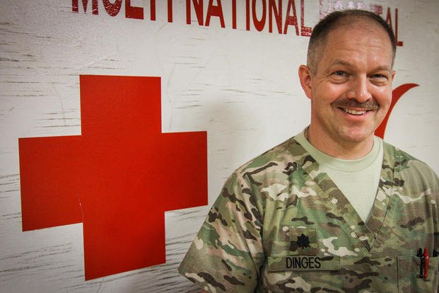 U.S. Navy Commander David Dinges smiles at NATO Role 3 Multi-National Medical Unit hospital, Kandahar Airfield, Afghanistan, March 21, 2014.