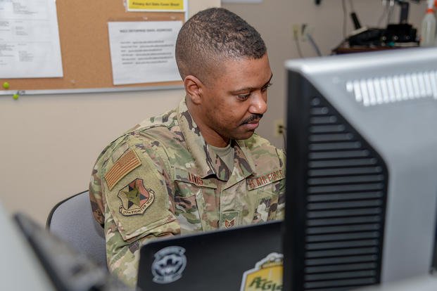 U.S. Air Force Staff Sgt. Trae Lewis reviews information at The Homeland Security Center of Excellence in Lawrenceville, N.J.