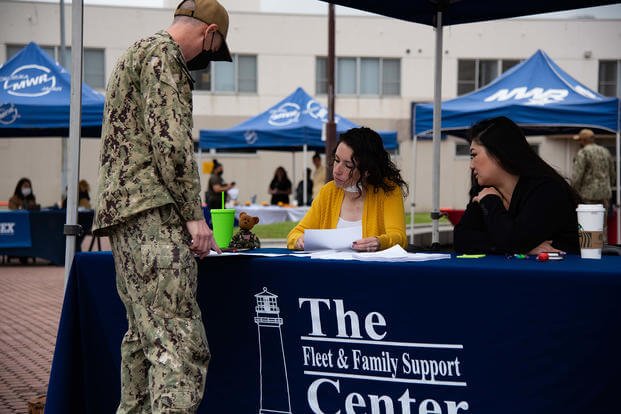Chief sonar technician (surface) Philip Clark, attached to Naval Surface Group Western Pacific onboard Commander, Fleet Activities Yokosuka (CFAY), speaks with certified resume reviewers at the Fleet and Family Support Center (FFSC) during a Family Employment Readiness Career Fair.