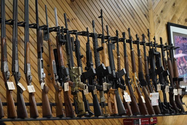 Various guns are displayed at a store in Maine.