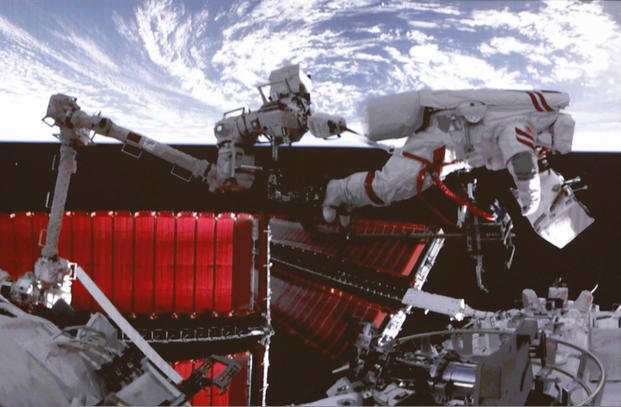 astronaut Fei Junlong conducting extravehicular activities on the orbiting Tiangong space station