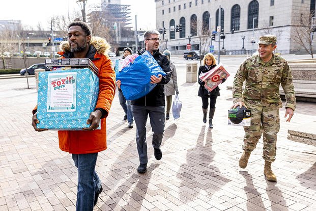 Employees of the U.S. Army Corps of Engineers Pittsburgh District deliver bags and boxes of toys to the Senator John Heinz History Center as part of the annual Castle Co-Op Toy Drive.
