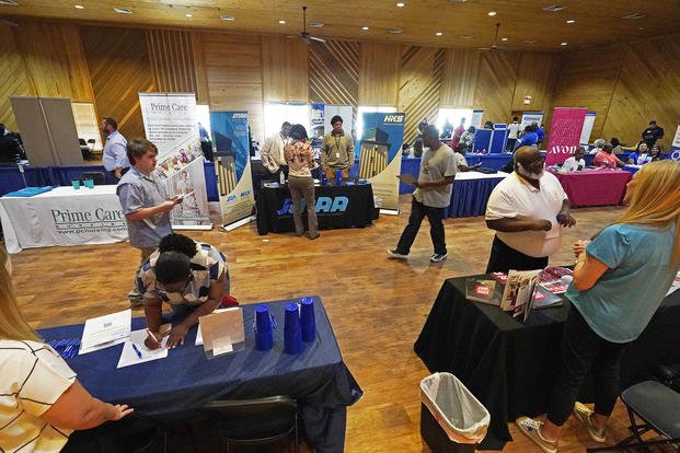Veterans, the formerly incarcerated and job seekers wanting to change professions attend the 2022 Mississippi Re-Entry Job Fair in Jackson, Miss.