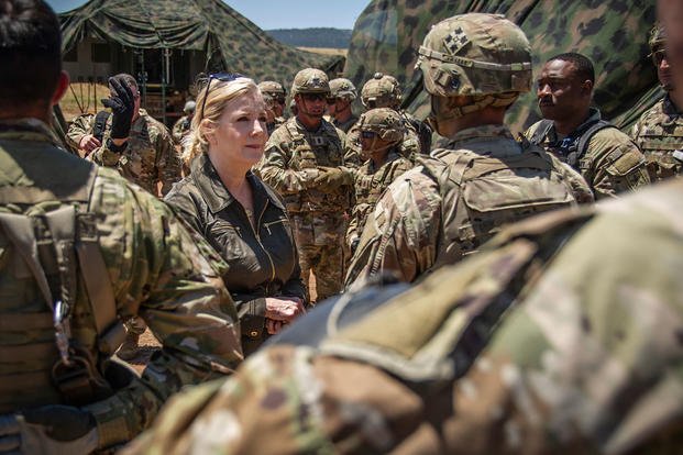 Christine Wormuth, U.S. Secretary of the Army, center, recognizes 4th Infantry Division soldiers