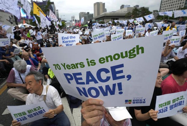 Participants stage a rally for peace unification of the Korean peninsula in Seoul, South Korea