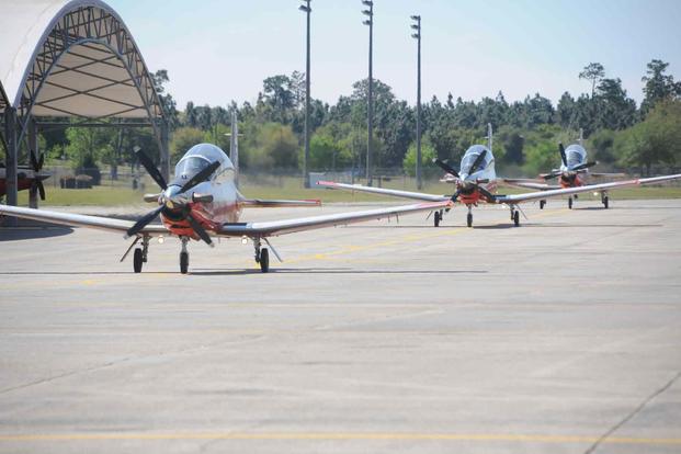 Naval aviators taxi back after training in T-6B Texan II aircraft