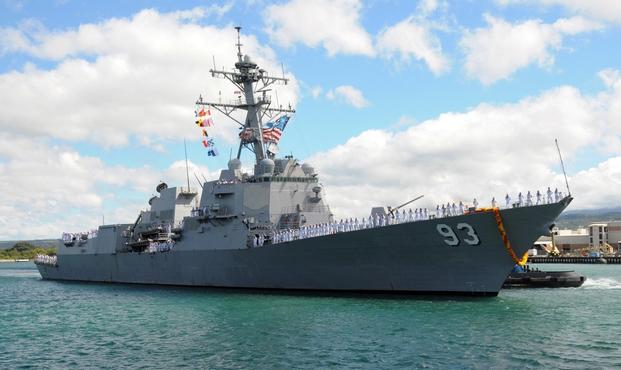 Sailors man the rails aboard the Arleigh Burke-class guided-missile destroyer USS Chung-Hoon as the ship pulls into Naval Station Pearl Harbor after a six-month deployment in the Western Pacific.