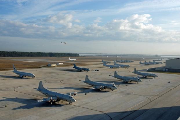 P-3C Orion and P-8A Poseidon aircraft occupy the flightline at Naval Air Station Jacksonville.