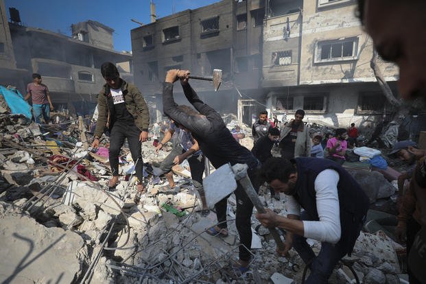 Palestinians search for survivors after an Israeli strike on the Gaza Strip.