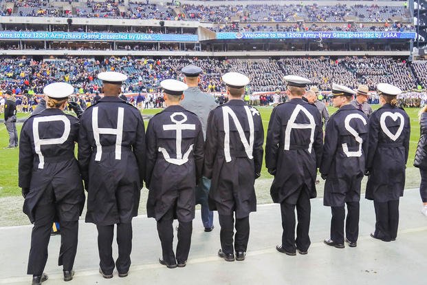 U.S. Military Academy cadets and U.S. Naval Academy midshipmen take part in the prisoner exchange before the Army-Navy Game in Philadelphia in 2019.
