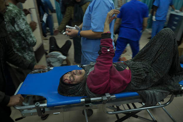 Palestinians wounded in the Israeli bombardment of the Gaza Strip are brought to the hospital