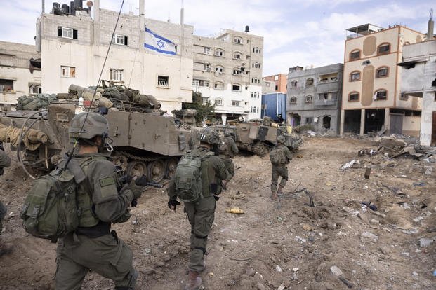 Israeli soldiers take part in a ground operation in Gaza City's Shijaiyah neighborhood