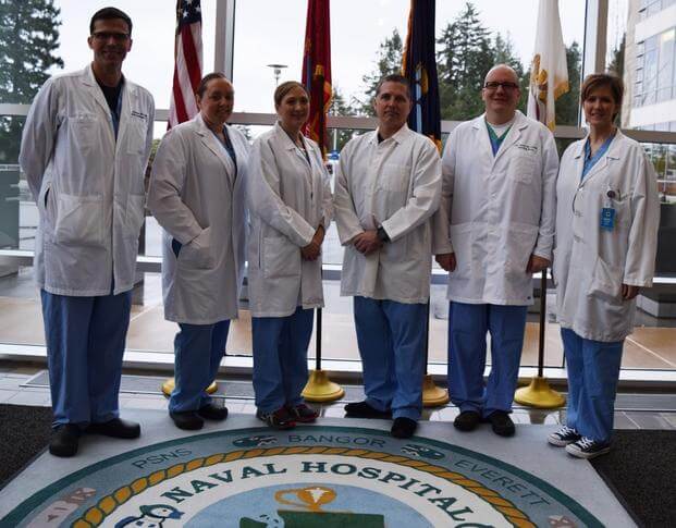 Naval Hospital Bremerton perioperative nurses take a momentary pause from the heeling cause to be recognized for the command's Main Operating Room becoming officially designated as a Certified Nurse Operating Room (CNOR) Strong facility with 100 percent of the nursing team maintaining their CNOR credentials.