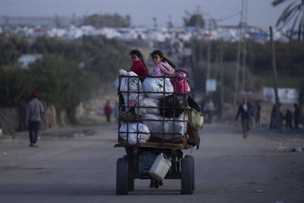 Palestinians who flee from Khan Younis from Israeli ground and air offensive on the Gaza Strip