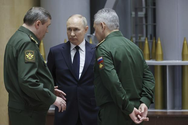 Russian President Vladimir Putin talks with Russian Chief of General Staff Gen. Valery Gerasimov