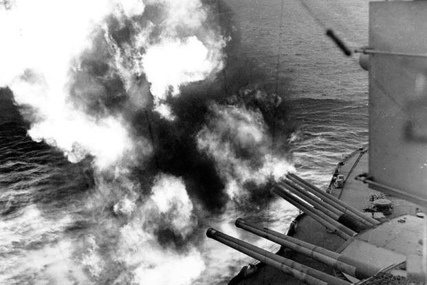 The USS Nevada fires on positions ashore during the landings at Utah Beach on D-Day, June 6, 1944. 