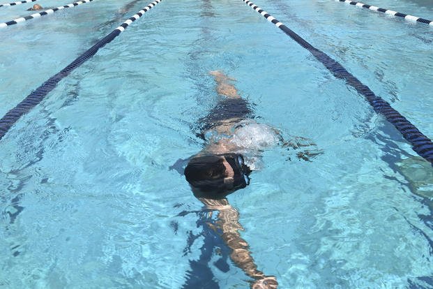 A sailor swims for the physical screening test held by Naval Special Warfare Assessment Command at Naval Air Station Sigonella.