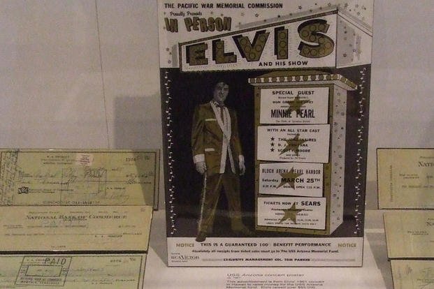 A poster from Elvis Presley's 1961 USS Arizona memorial benefit concert at Pearl Harbor is on display. 