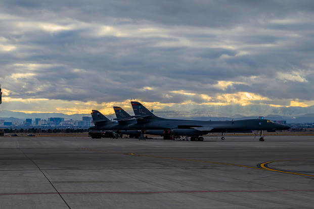 Three B-1B Lancer bomber aircraft assigned to the 37th Bomb Squadron at Ellsworth Air Force Base, South Dakota, sit on the flight line during Red Flag 21-1 at Nellis AFB, Nevada.