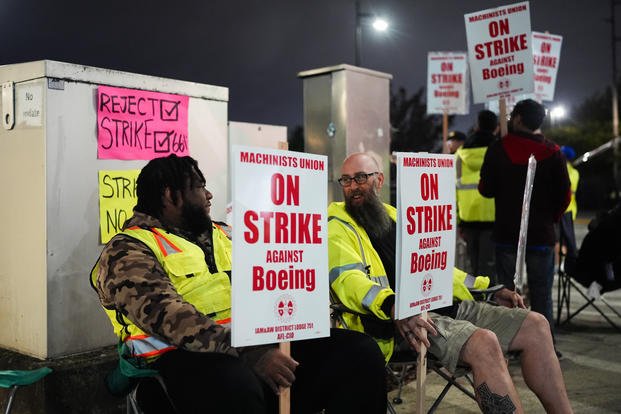 Solomon Hammond, 33, left, and John Olson, 45, right, both toolmakers at Boeing's Renton factory