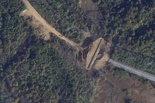 digging along a road in the Demilitarized zone between North and South Korea