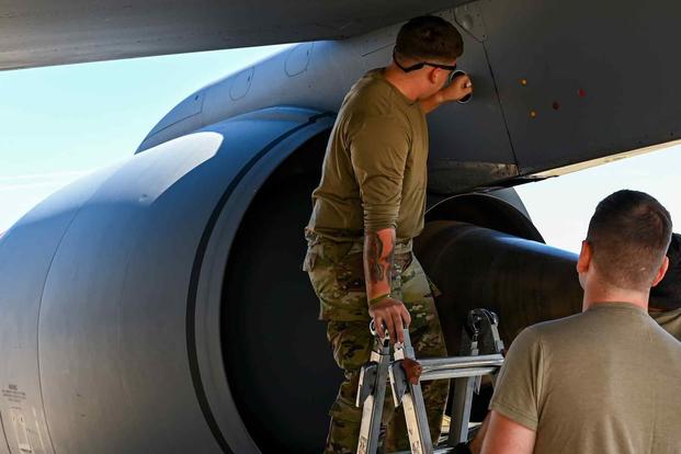 Aircraft Fuel Systems specialists diagnose a fuel leak in a KC-135