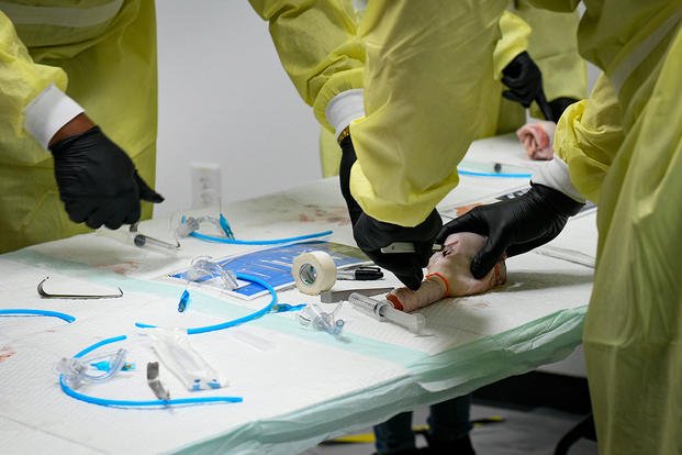 U.S. airmen practice cricothyrotomy