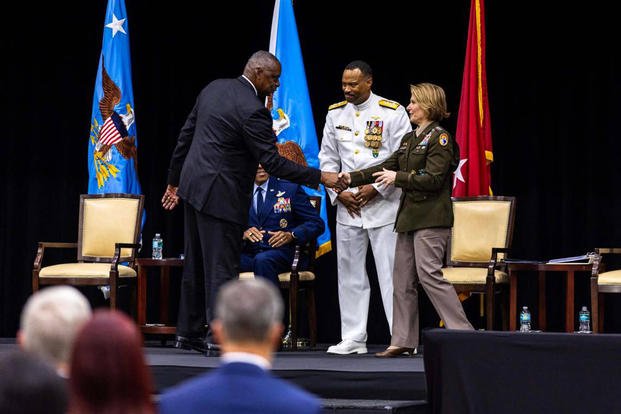 Defense Secretary Lloyd Austin shakes the hand of Army Gen. Laura J. Richardson during a Change of Command ceremony at U.S. Southern Command on Thursday, Nov. 7, 2024, in Doral, Fla. Richardson was replaced by Navy Adm. Alvin Holsey (center). 