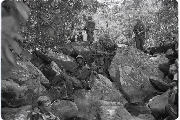 Marines of Company L, 3rd Battalion, 5th Marines, take a rest on rocky terrain near Dong Ha during Operation Hastings in Vietnam, July 1966. 