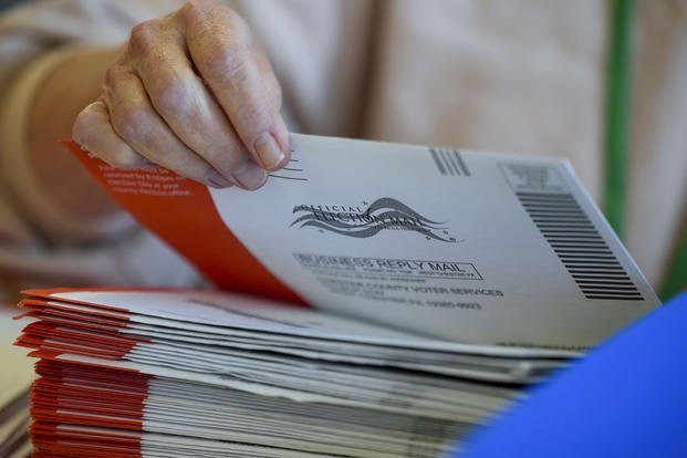 Election workers process mail-in ballots for the 2024 General Election at the Chester County, Pennsylvania, administrative offices on Nov. 5, 2024, in West Chester, Pa. (AP Photo/Matt Slocum)