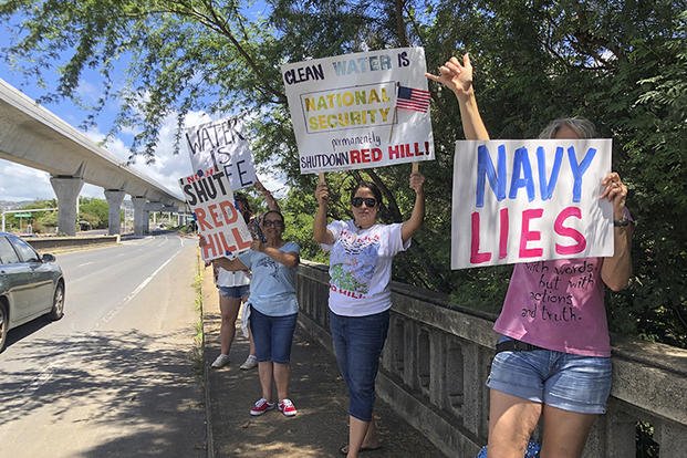 Protestors upset with the Department of Defense's response to the leak of jet fuel into the water supply