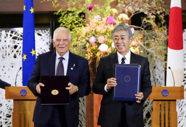 Japanese Foreign Minister Takeshi Iwaya, right, shakes hands with European Union foreign policy chief Josep Borrell