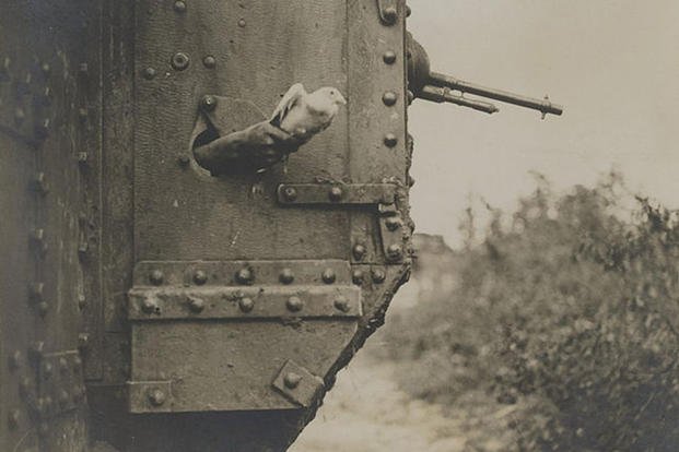 World War I saw old and new technology collide; here, we see a tank crew communicating by carrier pigeon. 