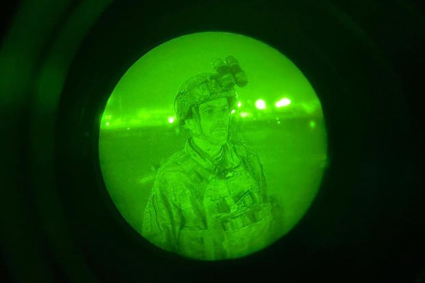 Maj. Gen. Chris Donahue, commander of the U.S. Army 82nd Airborne Division, XVIII Airborne Corps, boards a C-17 cargo plane at the Hamid Karzai International Airport in Kabul, Afghanistan. Maj. Gen. Donahue is the final American service member to depart Afghanistan. 