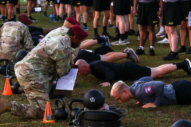 U.S. Army paratroopers assigned to the 82nd Airborne Division Artillery complete the hand-release push-up event of an Army Combat Fitness Test during the Best of the Best Competition on Fort Bragg, North Carolina.